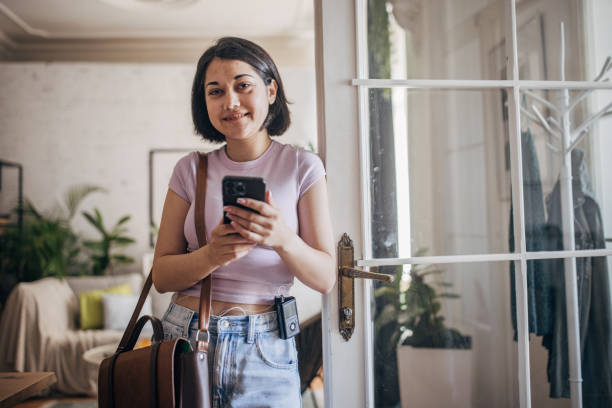 istock Woman confidently stepping out with phone and bag 2160604007