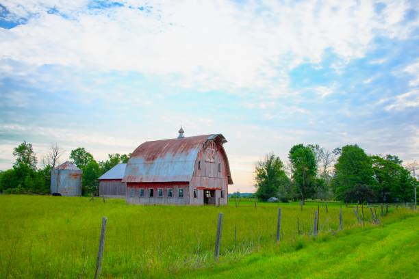 istock Old Weathered Red Barn at sunrise- Howard County, Indiana 2160604831