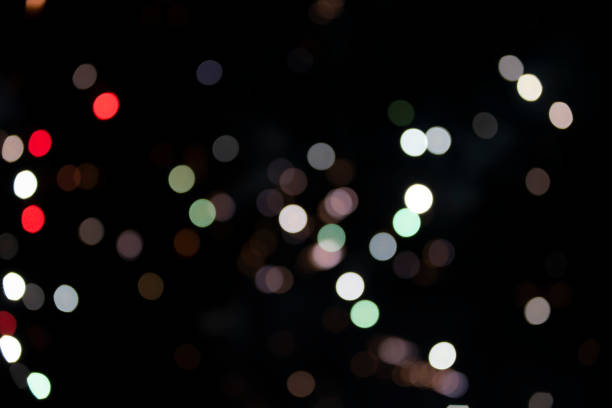 istock On a black background bokeh from explosions of colorful fireworks. 2160605454