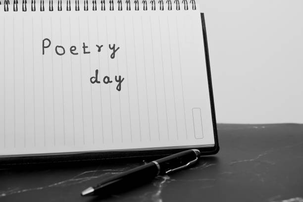 istock A pen and a notebook with the word poetry written on it 2160605770