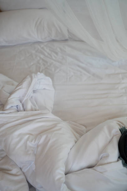 istock White bedding sheets after wake up in the morning. 2160606137