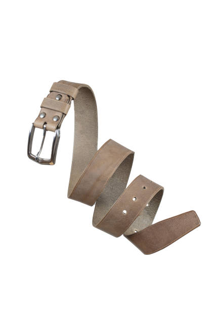 istock Beige leather belt twisted and isolated on a white background. 2160608600