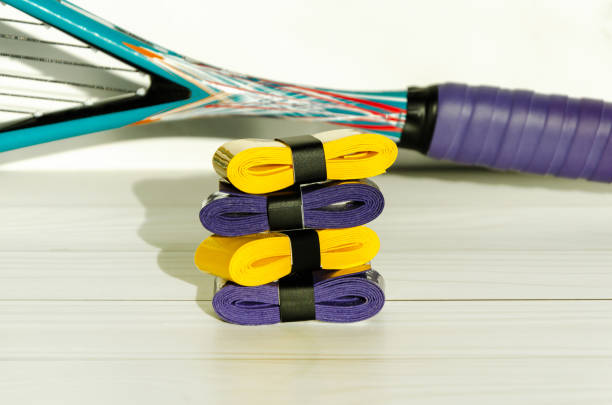 istock New overgrip tapes on squash racket. Wrapping on racket handle for anti-slip, moisture absorption 2160608741