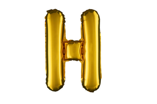 istock Helium gold balloon letter H isolated on white. 2160609115