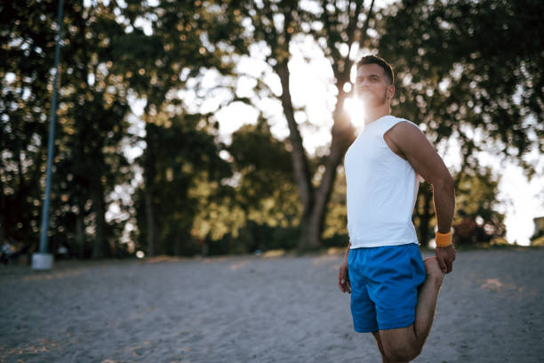 istock Morning stretch on the beach with sun shining bright 2160609161
