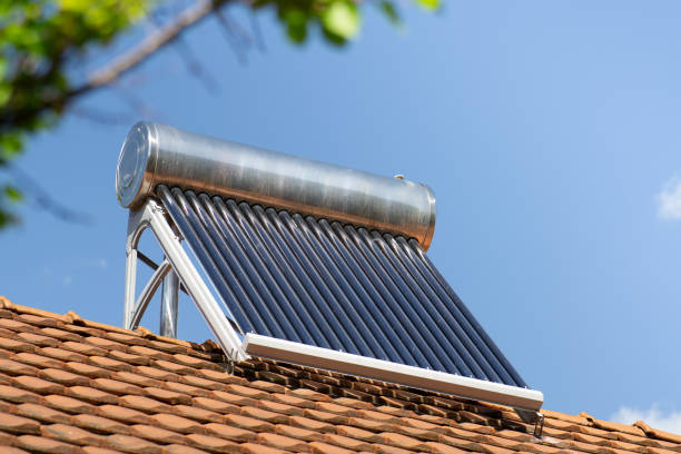 istock solar water heater on a roof top, solar water heating panel, blue sky in the background 2160610530