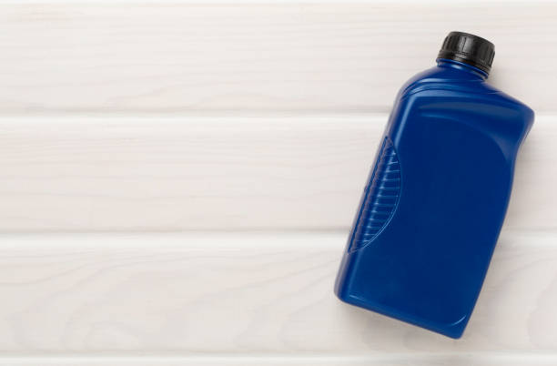 istock Machine oil on wooden background, top view 2160612809