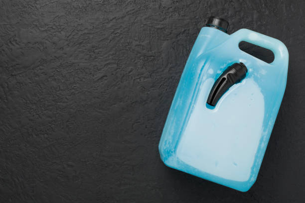 istock Can with antifreeze on concrete background, top view 2160612810