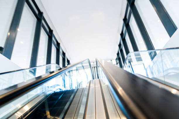 istock Escalators in modern shopping mall 2160614568