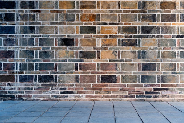 Brick wall with stone floor background.