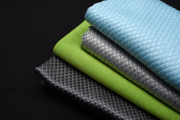 istock Colorful wiping cloths on a black background. A stack of rags. Cleaning material. 2160617635