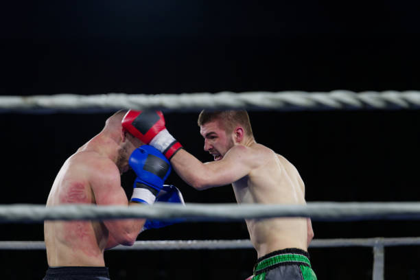 istock Fierce boxing match showcases athletes' power and skill. 2160624343