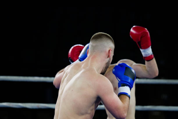 istock Fierce boxing match showcases athletes' power and skill. 2160625905