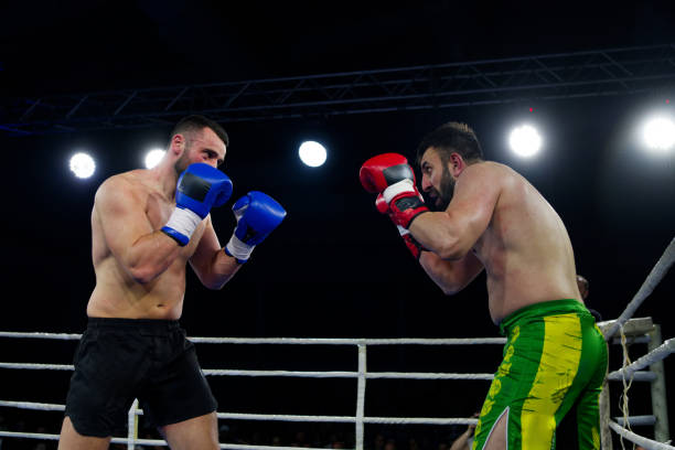 istock Fierce boxing match showcases athletes' power and skill. 2160627104