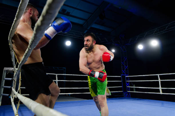 istock Fierce boxing match showcases athletes' power and skill. 2160627147