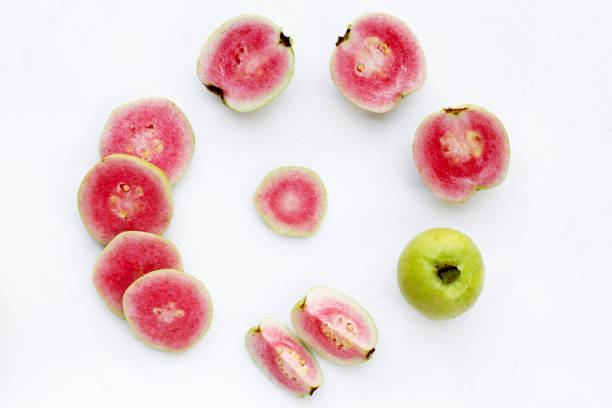 Fresh pink guava on white background.