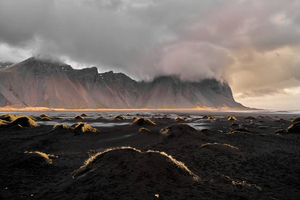 istock Cloudy Vestrahorn from the black sand dunes 2160639301
