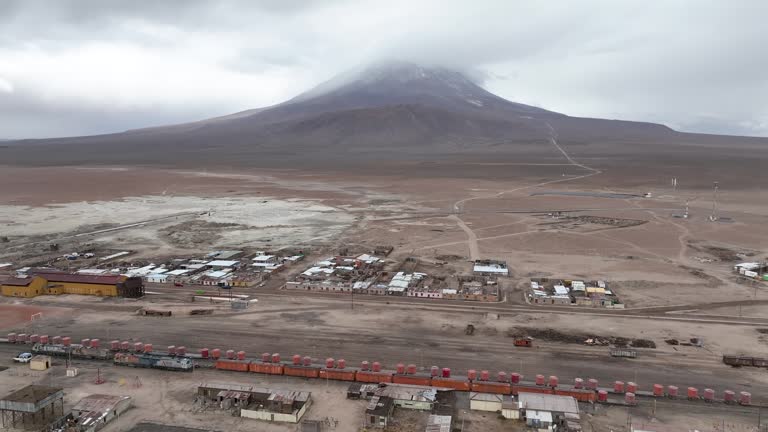 Ollague city and vulcan, El Loa. Border between Bolivia and northern Chile. Aerial view by drone.