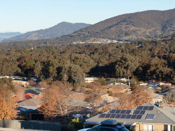 istock Looking down on rooftops with mountains in the distance 2160642233