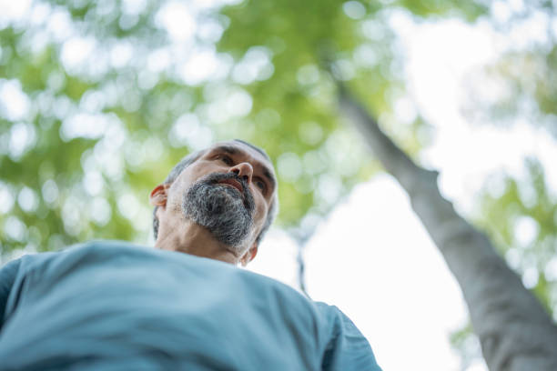 istock Mature Man Relaxes in the Woods. 2160645436