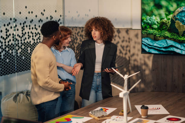 istock Diverse team working on innovative anti-pollution ideas at office. 2160645634