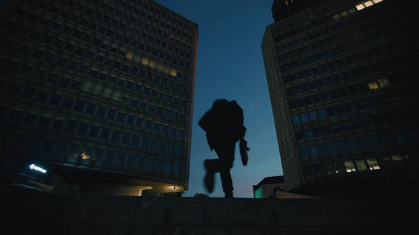 istock Senior Professional Strolls by Nighttime Urban Skyscrapers 2160645827
