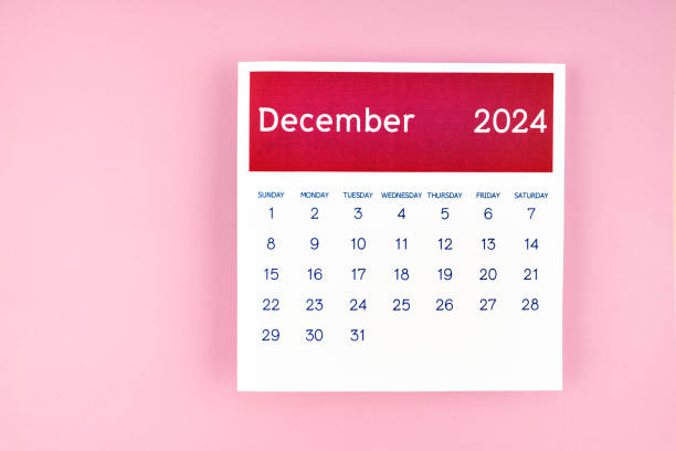 istock calendar page December 2024 on pink background. 2160658297