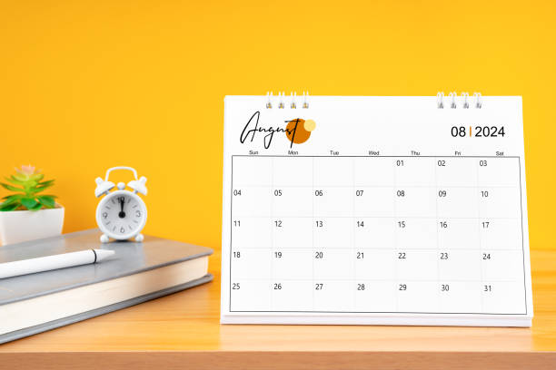 istock August desk calendar for 2024 year on work table with yellow background. 2160658384
