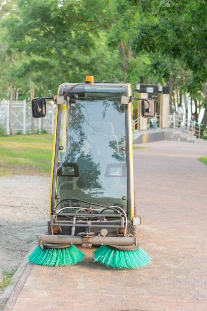 istock Park Maintenance Street Sweeper Vehicle Cleaning Path in Summer Day 2160659619