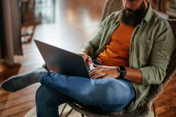 istock Man working on laptop at home. 2160661022
