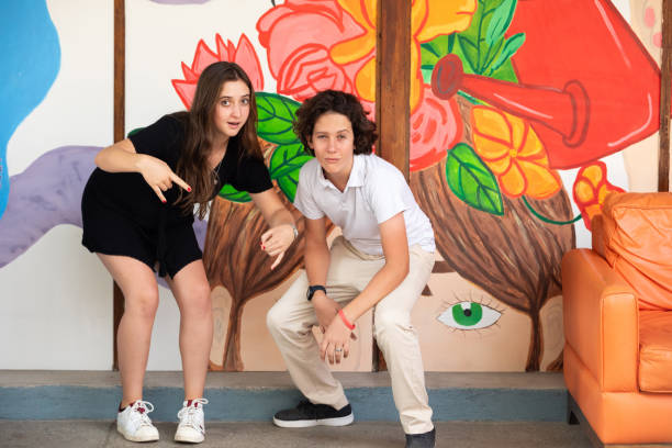 Two teenagers making crazy faces