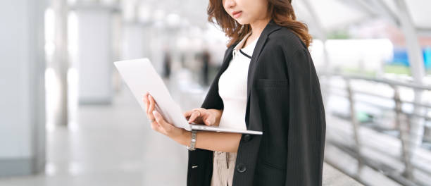 istock Business freelance woman busy using laptop computer at outdoor 2160672995