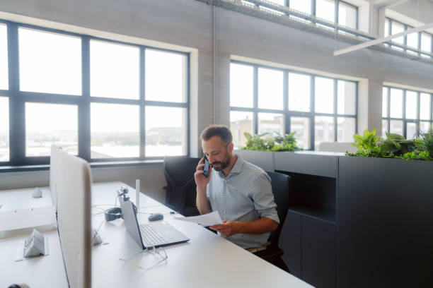 istock Mid adult man in the office 2160673966