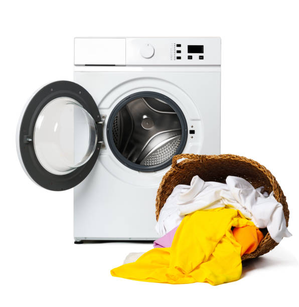 istock White Washing Machine With Open Door and Clothes Overflowing From a Wicker Basket 2160675576