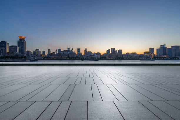 istock Night view of empty brick floor front of modern building . 2160676308