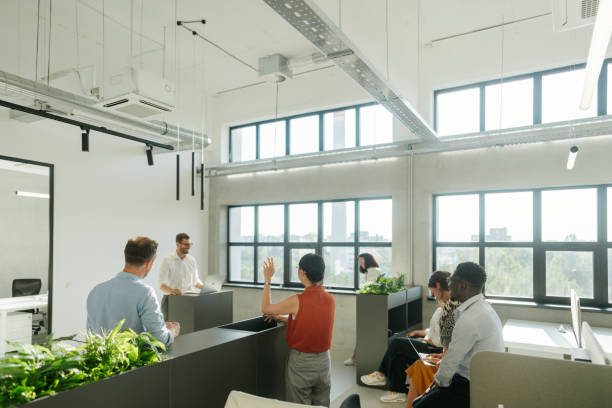 istock A man leading the meeting with his presentation 2160680002