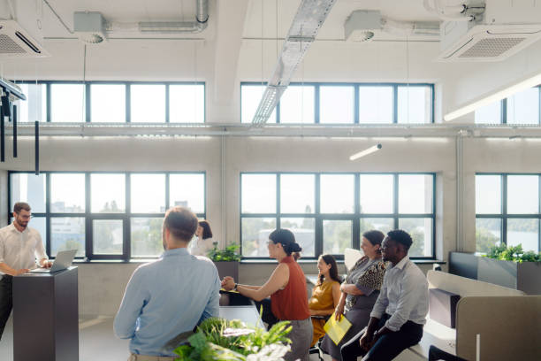 istock A man leading the meeting with his presentation 2160680064