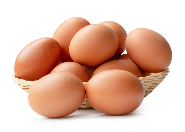 istock Front view of fresh brown chicken eggs in stack in wicker basket isolated on white background with clipping path 2160680163