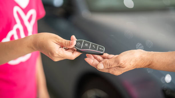 istock Buying a new car, taking the key. 2160684541
