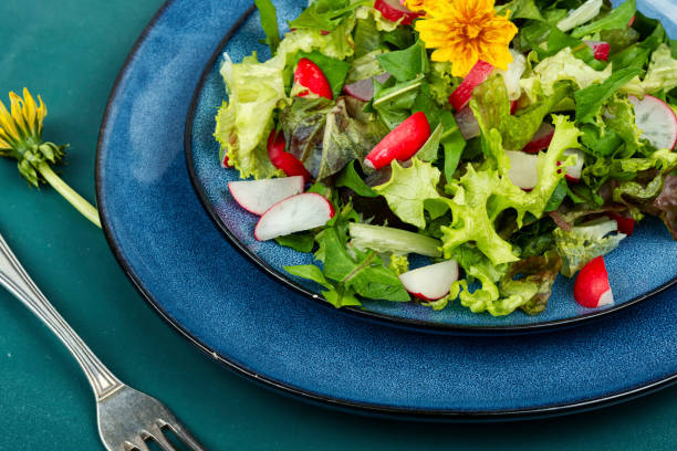 istock Fresh salad with dandelions. 2160684684