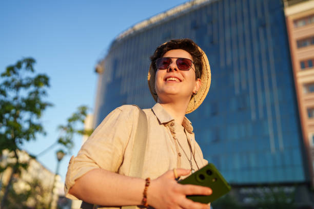 istock Woman using mobile phone in the walkable city. 2160688058