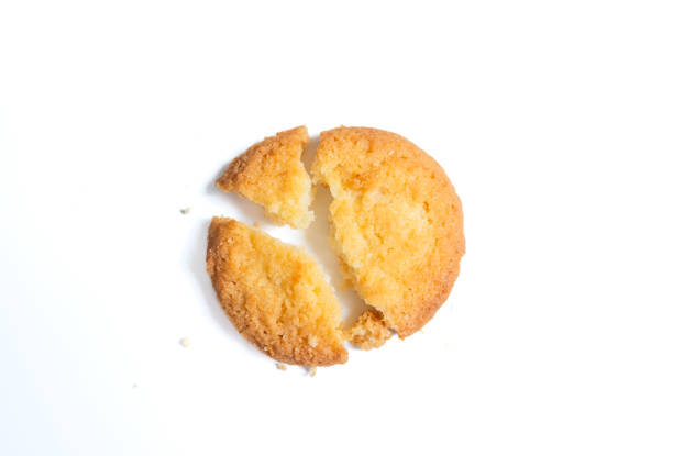 istock Broken tasty Danish butter cookie isolated on white, top view 2160688095