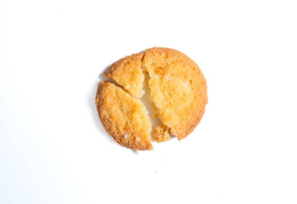 istock Broken tasty Danish butter cookie isolated on white, top view 2160688114