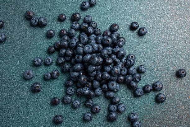 istock Fresh ripe blueberries as background, top view. 2160688378