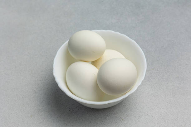 istock Boiled eggs in a white bowl on a gray background 2160688562