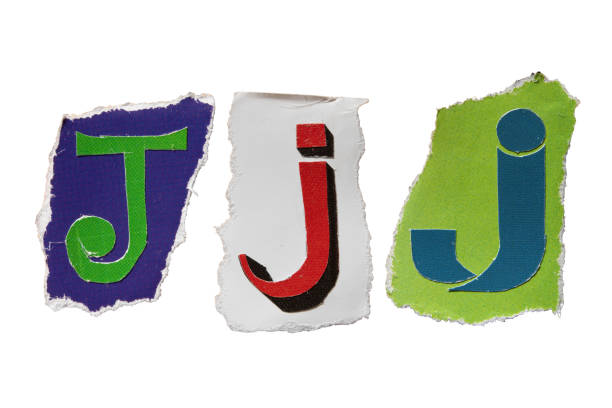 istock J alphabet torn from a magazine paper 2160689095