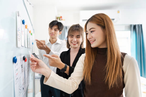 istock Creative UX/UI Team Brainstorming for Startup Business Development in Modern Office Environment 2160690937