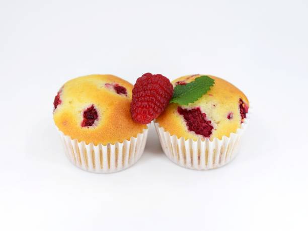 istock Muffins with raspberries on white background with fresh fruit 2160694217