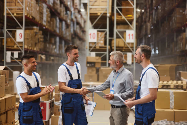 istock Successful deal among workers and manager in storage room! 2160696339
