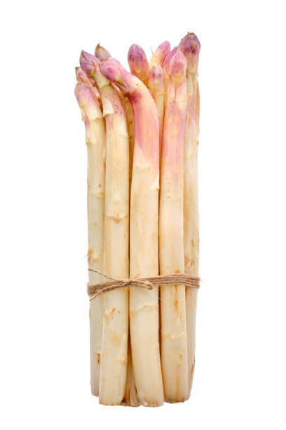 istock Bunch of asparagus stalks isolated on white background 2160696996